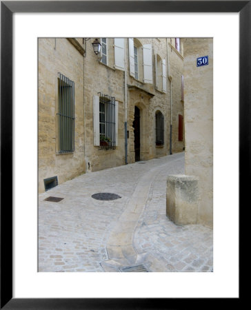 Cobblestone Street, Uzes, Languedoc-Roussilon, France by Lisa S. Engelbrecht Pricing Limited Edition Print image