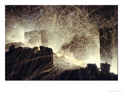 Sparks Fly From Fabrication Of A Steel Train Rail by B. Anthony Stewart Pricing Limited Edition Print image