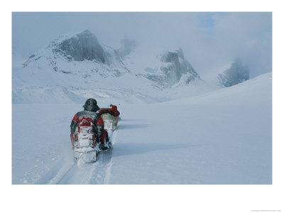 Climbers Travel Over Baffin Island Via Snowmobile-Towed Sleds by Gordon Wiltsie Pricing Limited Edition Print image