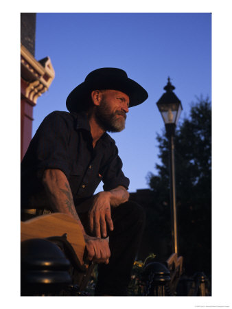 A Cowboy Stands Looking At The Sunset In A Western Town, Leadville, Colorado by Taylor S. Kennedy Pricing Limited Edition Print image