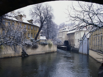 Snow-Covered Trees And Houses Backing Onto Canal Certovka, Prague, Czech Republic by Richard Nebesky Pricing Limited Edition Print image