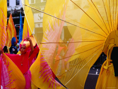 People In Costumes At Notting Hill Gates Annual Carnival, London, Greater London, England by Alain Evrard Pricing Limited Edition Print image