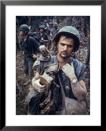 Dirty, Exhausted Looking Us Marine On Patrol With His Squad Near The Dmz During The Vietnam War by Larry Burrows Pricing Limited Edition Print image