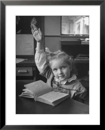 School Girl Raising Her Hand To Answer A Question by Nina Leen Pricing Limited Edition Print image