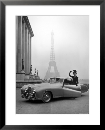 Model Wearing Jacques Fath Ensemble Beside 1947 Model Delahaye Automobile by Tony Linck Pricing Limited Edition Print image