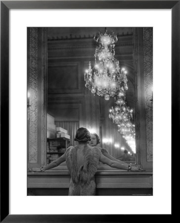Model In Ostrich Feather Trimmed Gown Pausing To Regard Herself In Grand Mirror Of Molyneux Atelier by Alfred Eisenstaedt Pricing Limited Edition Print image