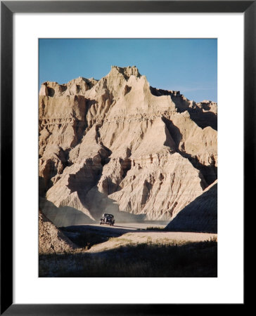 Car Driving Through Rocky Landscape In Badlands National Park by Andreas Feininger Pricing Limited Edition Print image