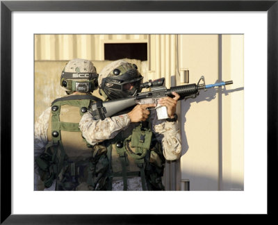 An Infantry Scout Aims His Weapon At Role-Playing Insurgents During A Cordon-And-Knock Operation by Stocktrek Images Pricing Limited Edition Print image