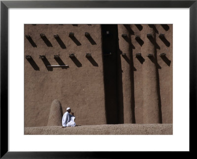 Man Sitting At Base Of Mud-Brick Wall Of The Grand Mosque, Djenne, Mopti, Mali by Jane Sweeney Pricing Limited Edition Print image