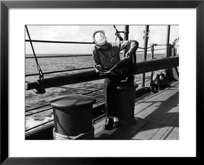 Sailor Relaxing Aboard A Us Navy Cruiser At Sea While Reading A Copy Of Life Magazine During Wwii by Ralph Morse Pricing Limited Edition Print image