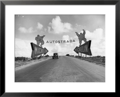 Michelin Man On Billboards At Entrance To The Turin Milan Autostrada by Alfred Eisenstaedt Pricing Limited Edition Print image