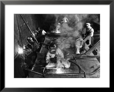 Female Welders Welding Seams On Deck Section Of An Aircraft Carrier Under Construction At Shipyard by Margaret Bourke-White Pricing Limited Edition Print image