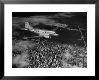 Plane Flying Over A City From A Story Concerning United Airlines by Carl Mydans Pricing Limited Edition Print image