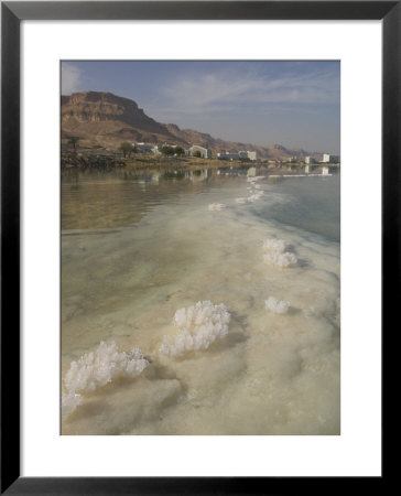 Sea And Salt Formations With Hotels And Desert Cliffs Beyond, Dead Sea, Israel, Middle East by Simanor Eitan Pricing Limited Edition Print image