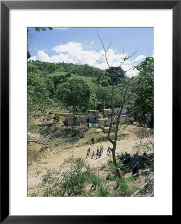 Houses And People Walking In Dry River Bed Caused By Erosion, Near Petionville, Haiti, West Indies by Lousie Murray Pricing Limited Edition Print image