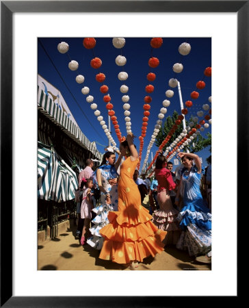 Girls Dancing A Sevillana Beneath Colourful Lanterns, Feria De Abril, Seville, Andalucia, Spain by Ruth Tomlinson Pricing Limited Edition Print image