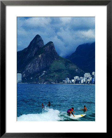 Catching A Wave Under The Gaze Of Sugar Loaf In Rio De Janeiro, Rio De Janeiro, Brazil by John Maier Jr. Pricing Limited Edition Print image