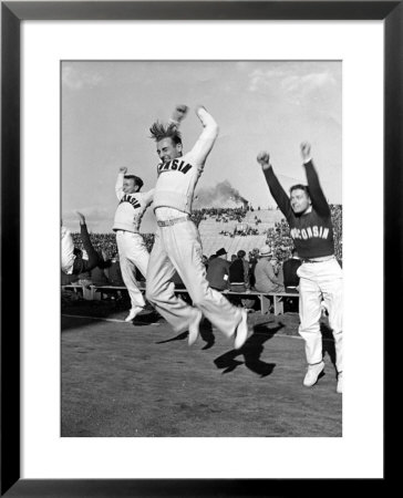 Male Cheerleaders In Action At Wisconsin-Marquette Football Game by Alfred Eisenstaedt Pricing Limited Edition Print image