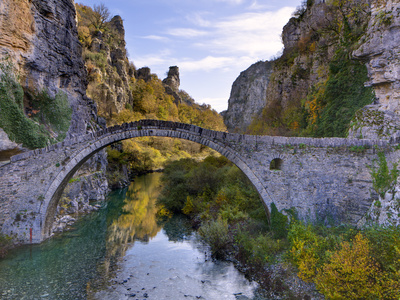 The 18Th Century Kokoris Packhorse Bridge, Near Kipi In Autumn, Epirus, Greece, Europe by Lizzie Shepherd Pricing Limited Edition Print image