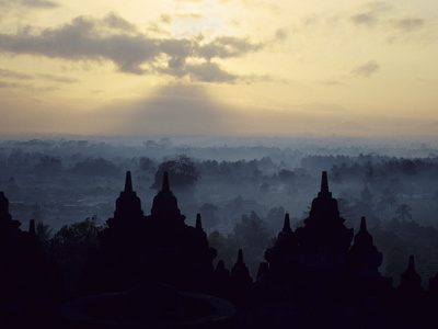 The Temple Of Borobodur At Dawn, Backdrop Of Mist-Shrouded Volcanoes, Borobodur, Unesco World Herit by Lizzie Shepherd Pricing Limited Edition Print image