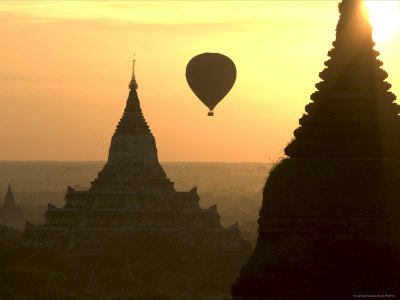 Temples And Hot-Air Balloon Silhouetted At Sunrise by Jerry Alexander Pricing Limited Edition Print image