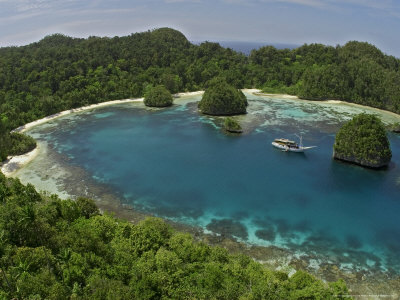 Live-Aboard Dive Vessel At Anchor In The Raja Ampat Islands, Indonesia by David B. Fleetham Pricing Limited Edition Print image