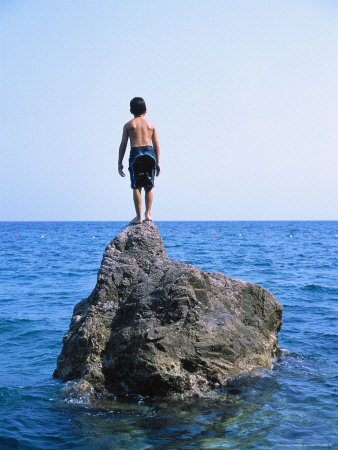Boy Standing Alone On Rock, Italy by Terri Froelich Pricing Limited Edition Print image