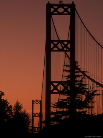 Sun Setting Behind Bridge And Trees by Fogstock Llc Pricing Limited Edition Print image