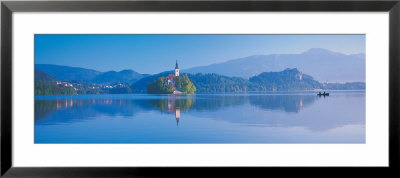 Reflection Of Mountains And Buildings In Water, Lake Bled, Slovenia by Panoramic Images Pricing Limited Edition Print image