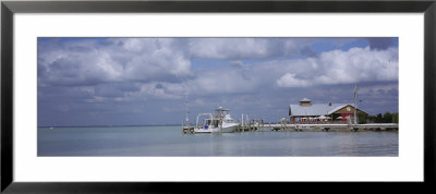 Motorboat At A Dock Near A Boathouse, Sarasota Bay, Sarasota, Florida, Usa by Panoramic Images Pricing Limited Edition Print image