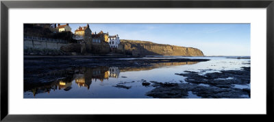 Reflection Of Buildings In Water, Robin Hood's Bay, North Yorkshire, England, United Kingdom by Panoramic Images Pricing Limited Edition Print image