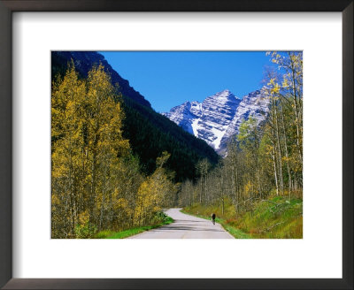 Cyclist On Road To Maroon Bells, Aspen, Colorado by Holger Leue Pricing Limited Edition Print image