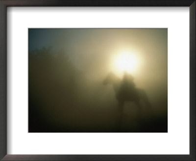 A Person On A Horse Is Silhouetted In The Fog by Sisse Brimberg Pricing Limited Edition Print image