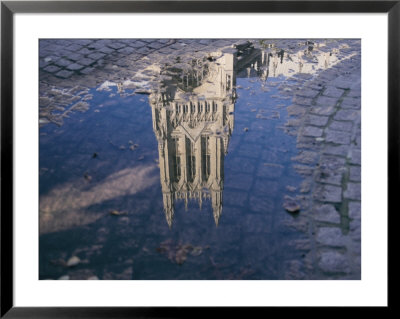 A Puddle Reflects The Central Tower Of The Majestic Washington National Cathedral by Stephen St. John Pricing Limited Edition Print image