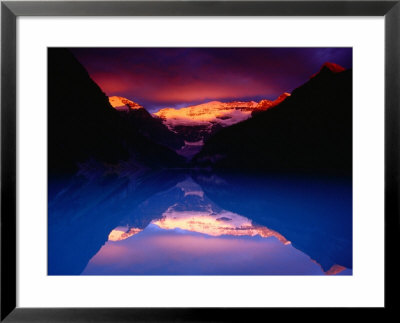 Stormy Alpenglow Lights Up Mt. Victoria And Lake Louise, Banff National Park, Alberta, Canada by Gareth Mccormack Pricing Limited Edition Print image