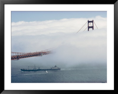 A Blanket Of Fog Covers Part Of Californias Golden Gate Bridge As A Tanker Passes Underneath by James L. Stanfield Pricing Limited Edition Print image