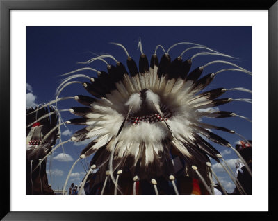View From Behind Of Blood Indians Wearing Tribal Feather Headdresses by Sam Abell Pricing Limited Edition Print image