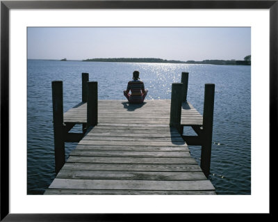 A Woman In A Yoga Pose At The End Of A Dock by Taylor S. Kennedy Pricing Limited Edition Print image