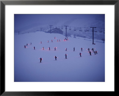 Skiers In An S Formation Make Their Way Down A Gentle Slope At Twilight by Paul Chesley Pricing Limited Edition Print image