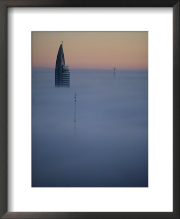 Morning Fog Obscures All But The Top Of A High Rise In Montevideo by Pablo Corral Vega Pricing Limited Edition Print image
