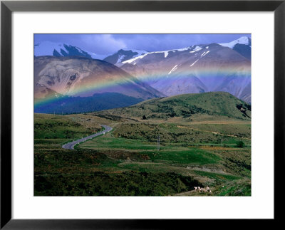 Rainbow Over Road Leading To Snow-Capped Mountains, Arthur's Pass National Park, New Zealand by Christopher Groenhout Pricing Limited Edition Print image