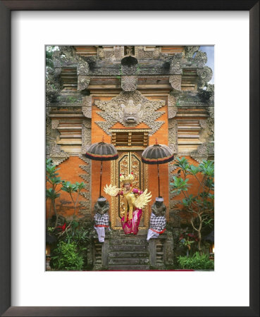 Balinese Dancer Wearing Traditional Garb Near Palace Doors In Ubud, Bali, Indonesia by Jim Zuckerman Pricing Limited Edition Print image