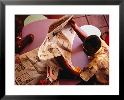 Men Reading Newspaper At Tekka Central Market, Little India, Singapore, Singapore by Phil Weymouth Pricing Limited Edition Print image