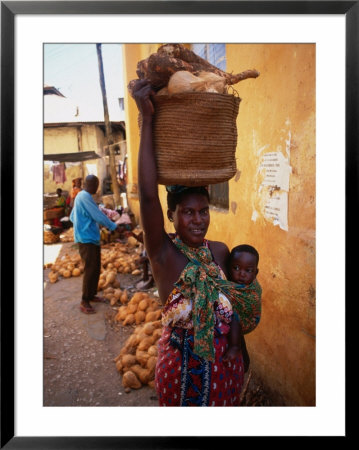 Mother Carrying Baby And Basket, Mombasa, Kenya by Wayne Walton Pricing Limited Edition Print image