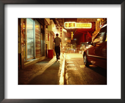 Man And A Taxi On A Shop-Lined Hong Kong Street At Night by Eightfish Pricing Limited Edition Print image