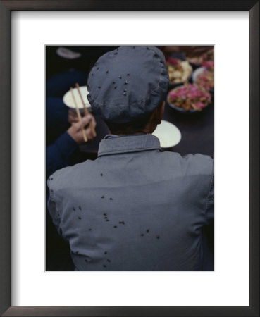 Back View Of Chinese Man Eating, With Flies On His Hat And Shirt by Jodi Cobb Pricing Limited Edition Print image