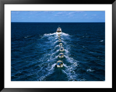Torres Strait Fishing Boat Towing Seven Dories (Small Dinghies), Australia by Oliver Strewe Pricing Limited Edition Print image