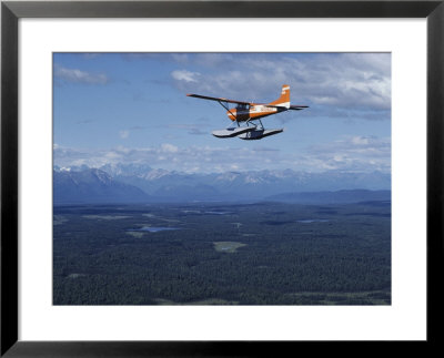 A Cessna Plane Flies Over Backcountry Air Lanes Near The Alaska Range by Ira Block Pricing Limited Edition Print image