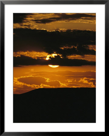The Sun Sets Over 70 Mile Butte In Grasslands National Park by Raymond Gehman Pricing Limited Edition Print image