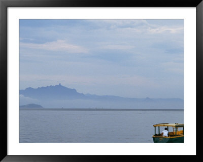 A Man In A Boat On A Foggy Morning by Raul Touzon Pricing Limited Edition Print image